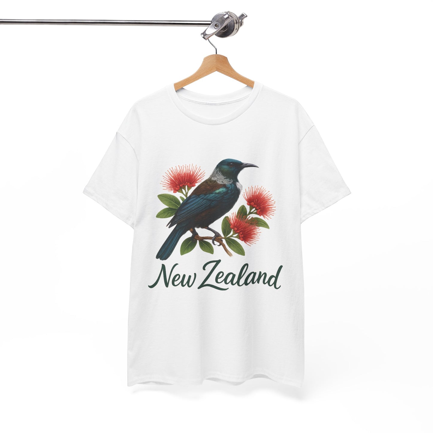 White t-shirt with a bird and flowers design and 'New Zealand' text on a hanger against a white background