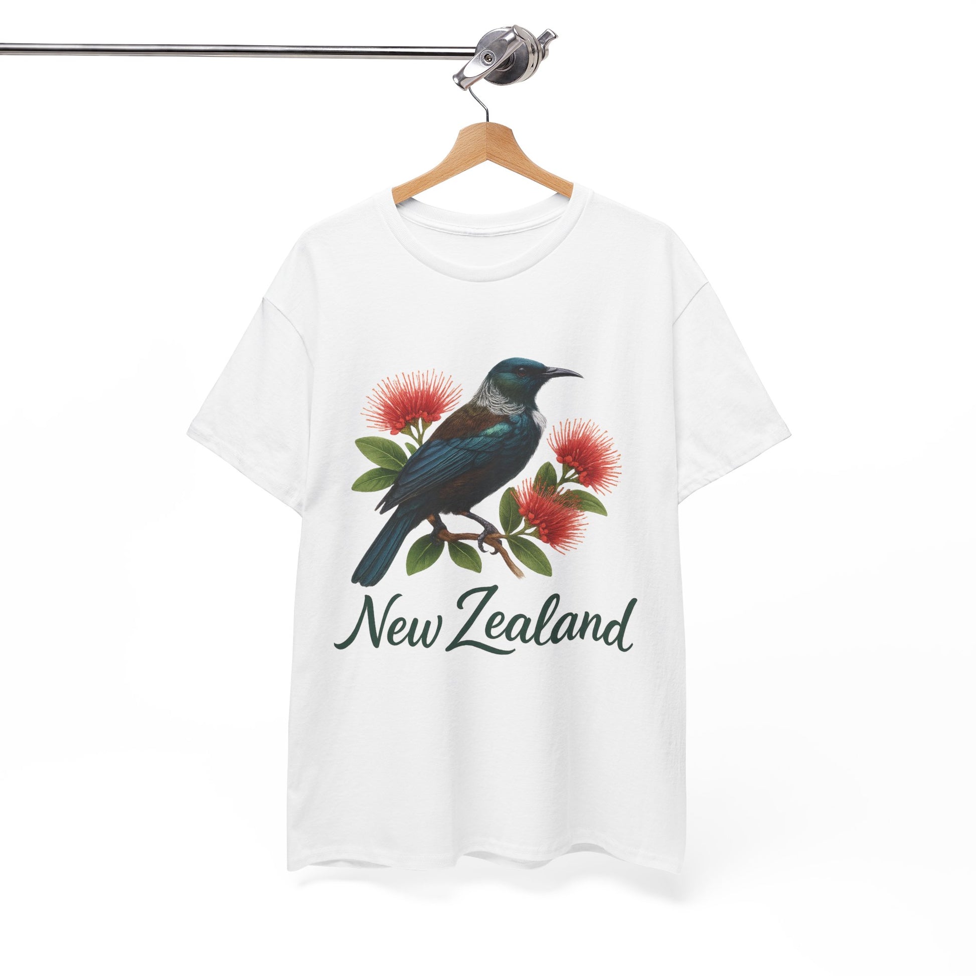 White t-shirt with a bird and flowers design and 'New Zealand' text on a hanger against a white background