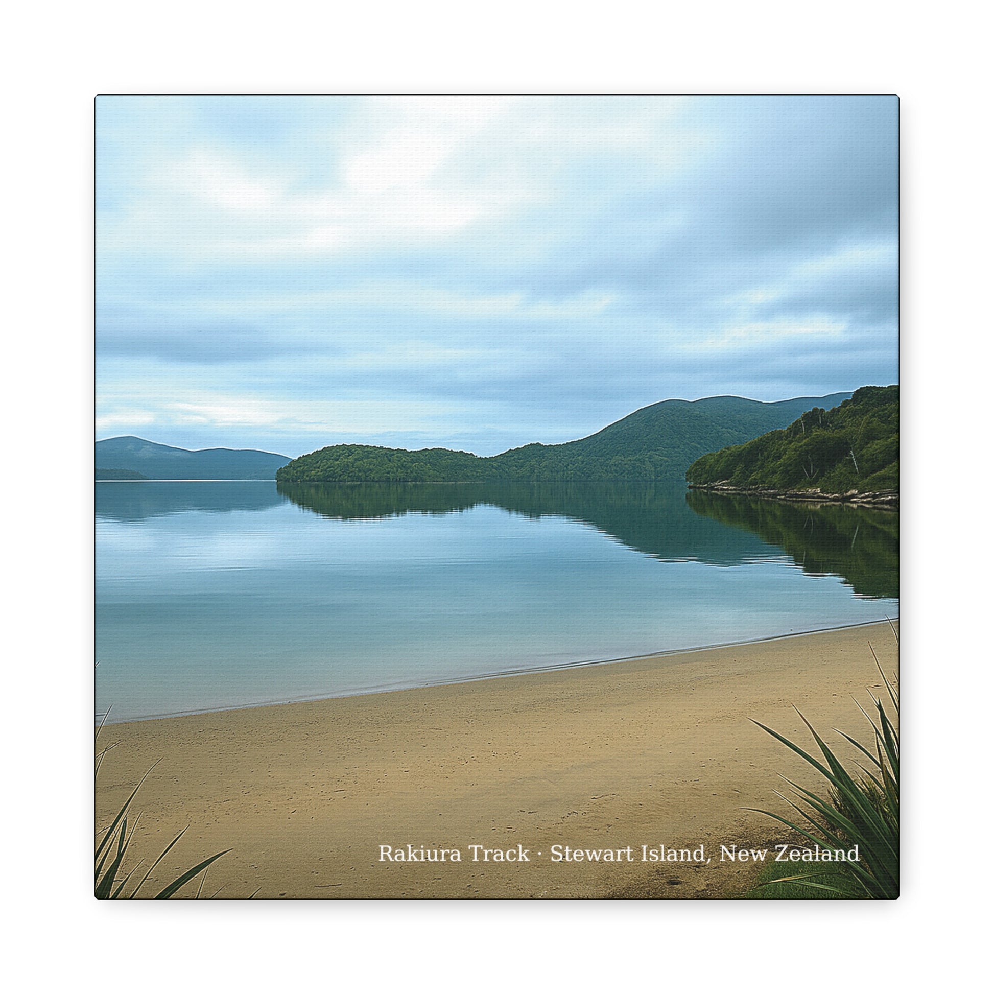 Scenic view of a Rakiura Track beach with mountains and reflection in New Zealand