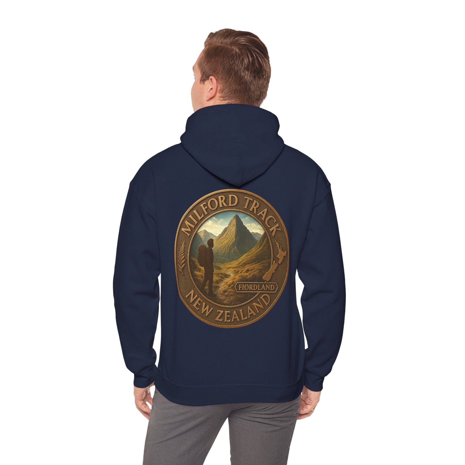 Navy blue hoodie with Milford Track New Zealand design on the back, worn by a person.