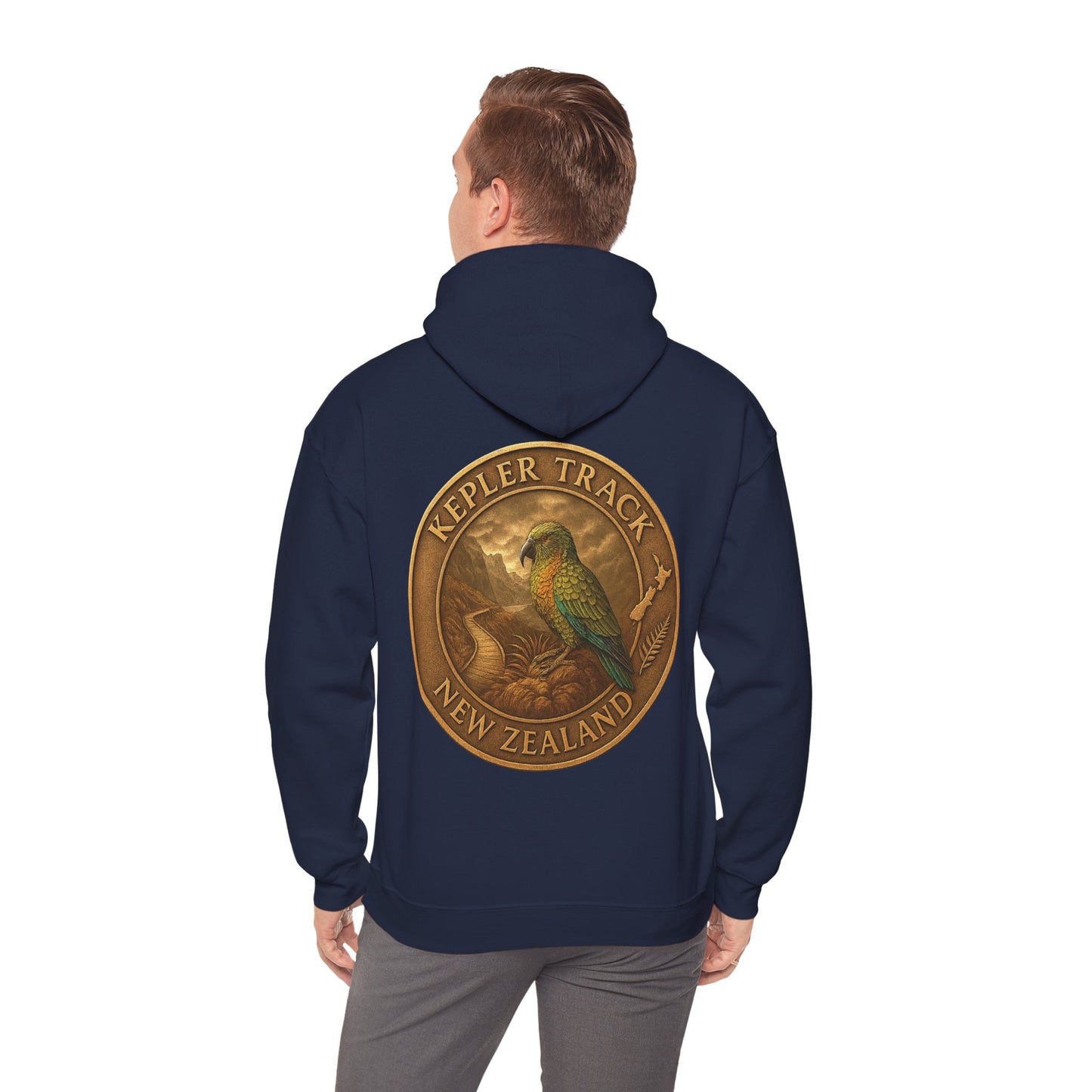 Navy blue Kepler Track hoodie with a gold and green emblem on the back, worn by a person.